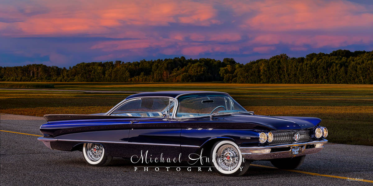 A beautiful light-painted photograph of a Midnight Blue 1960 Buick Invicta Custom.
