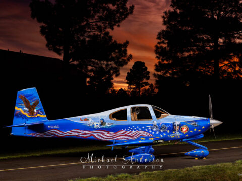A stunning light-painted photograph of the Starboard side of Liberty N104AZ at sunset.