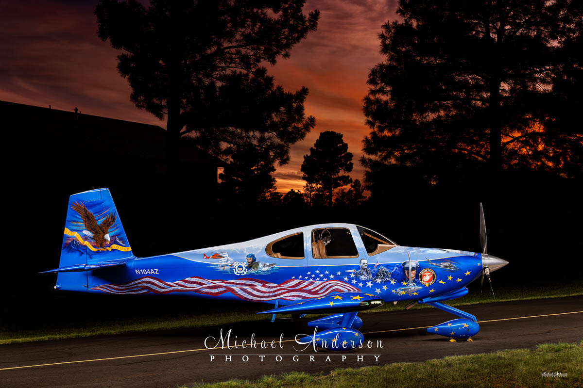 A stunning light-painted photograph of the Starboard side of Liberty N104AZ at sunset.
